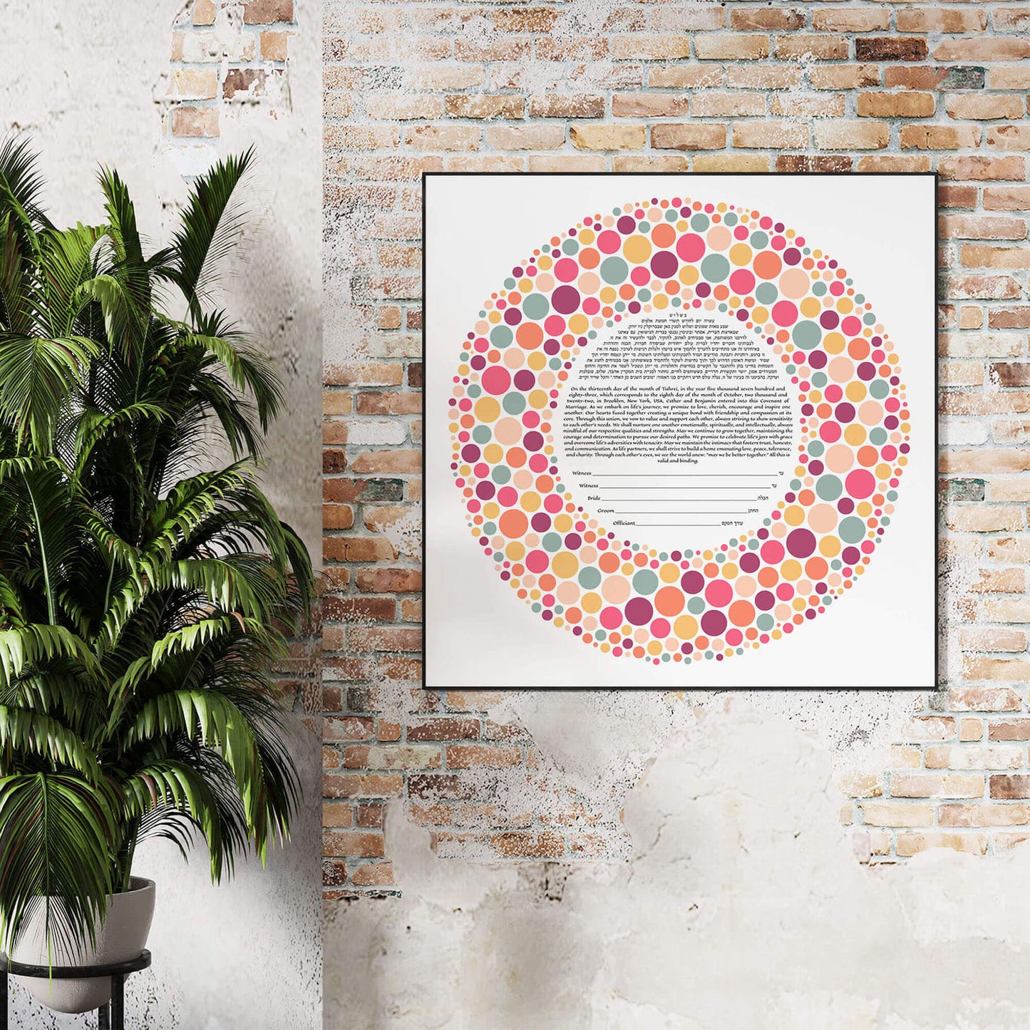 Abstract colorful dots modern ketubah displayed on a brick wall