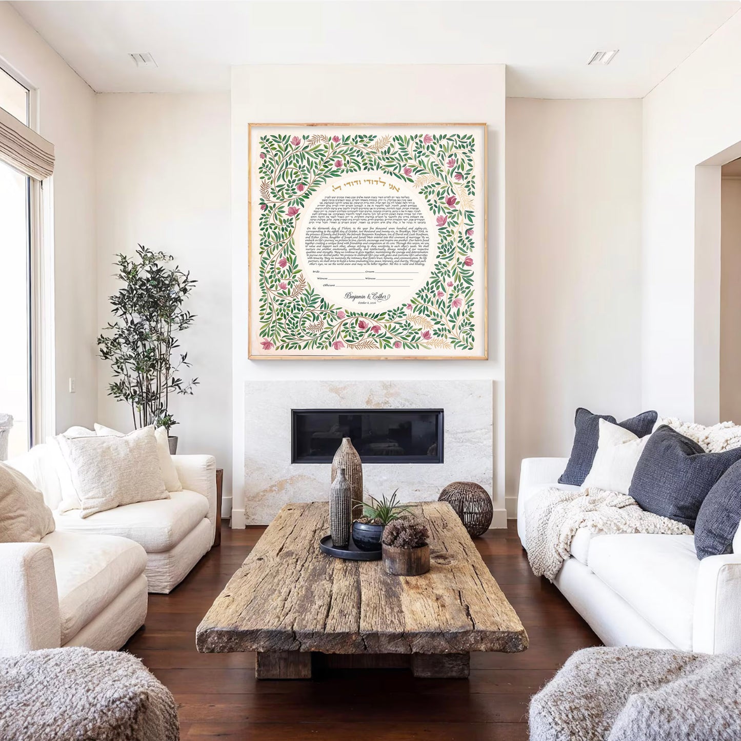 beautiful watercolor ketubah in a wooden frame hung above a fireplace