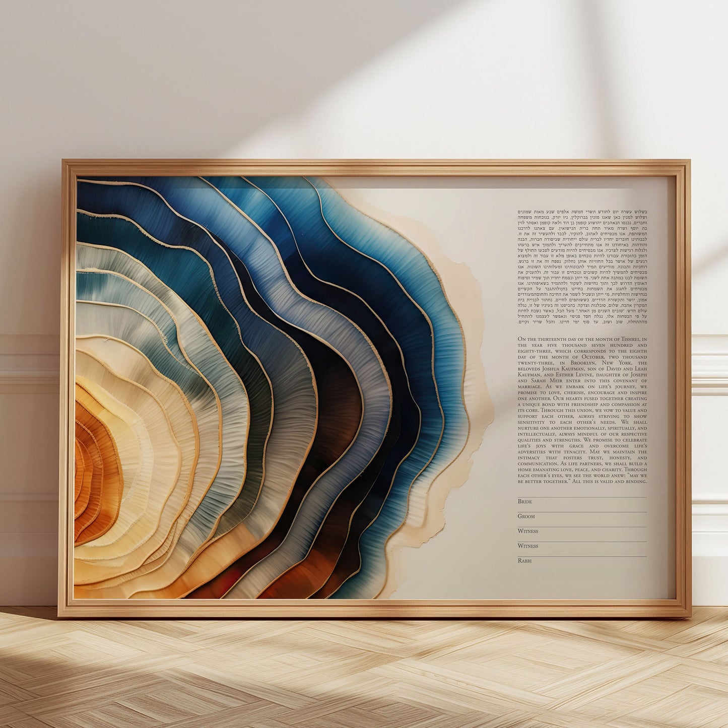 Framed abstract ketubah with wavy color patterns on a wall.
